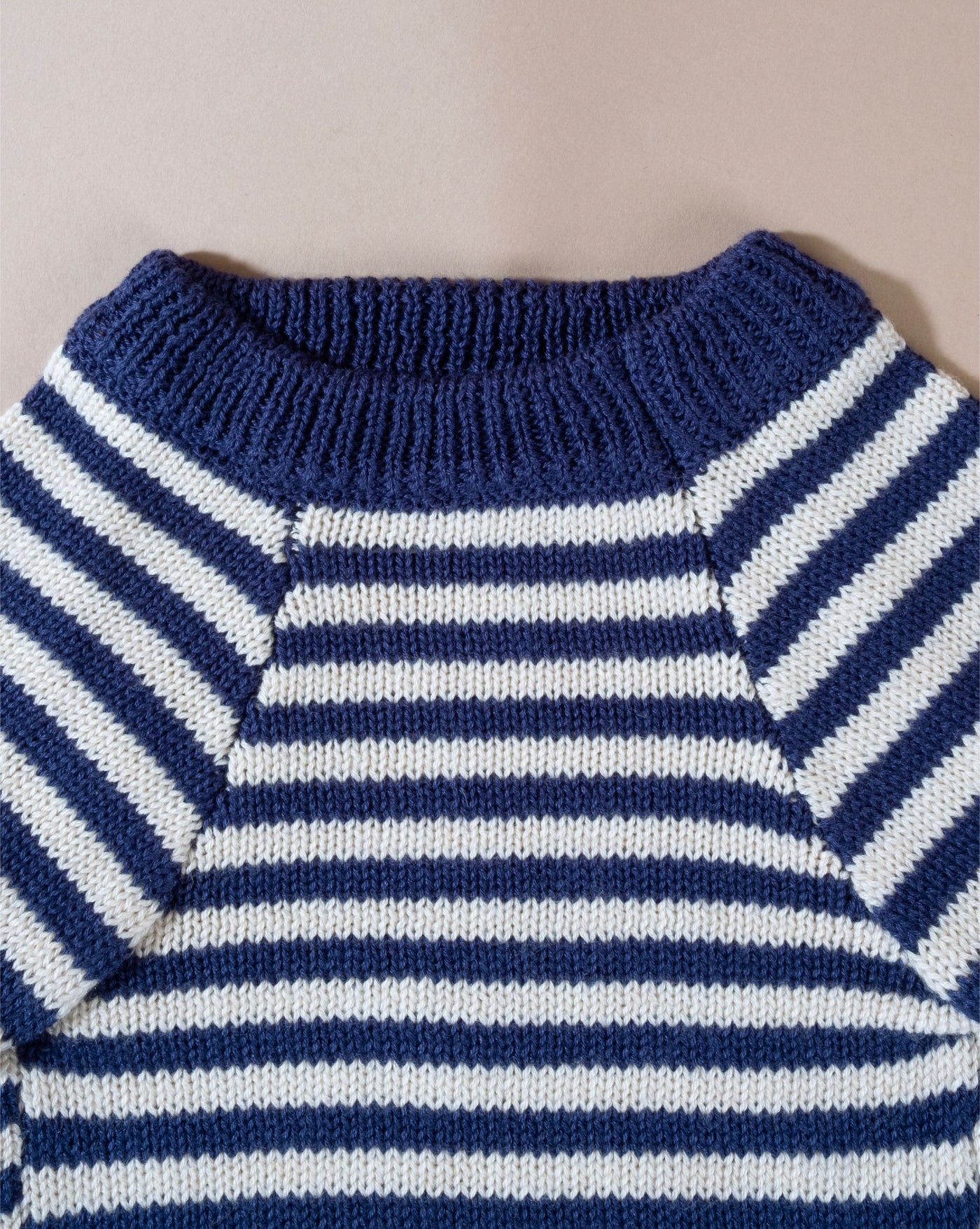 Stylish knit stripe dog sweater, perfect for French Bulldogs, featuring a soft wool blend for winter warmth.