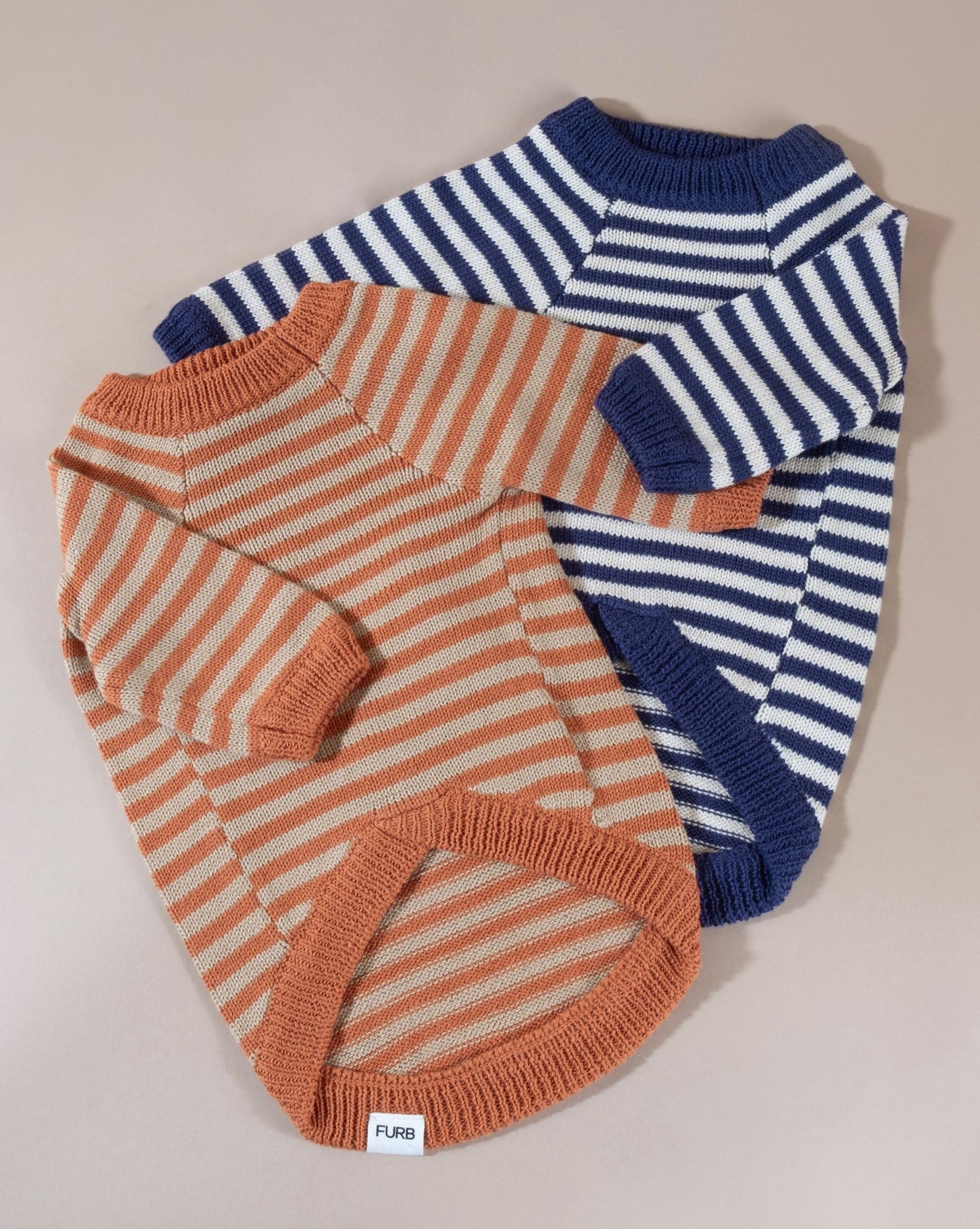 Sweater for your Bulldog? Rock this knit stripe sweater designed for dogs, offering warmth and a tailored fit.