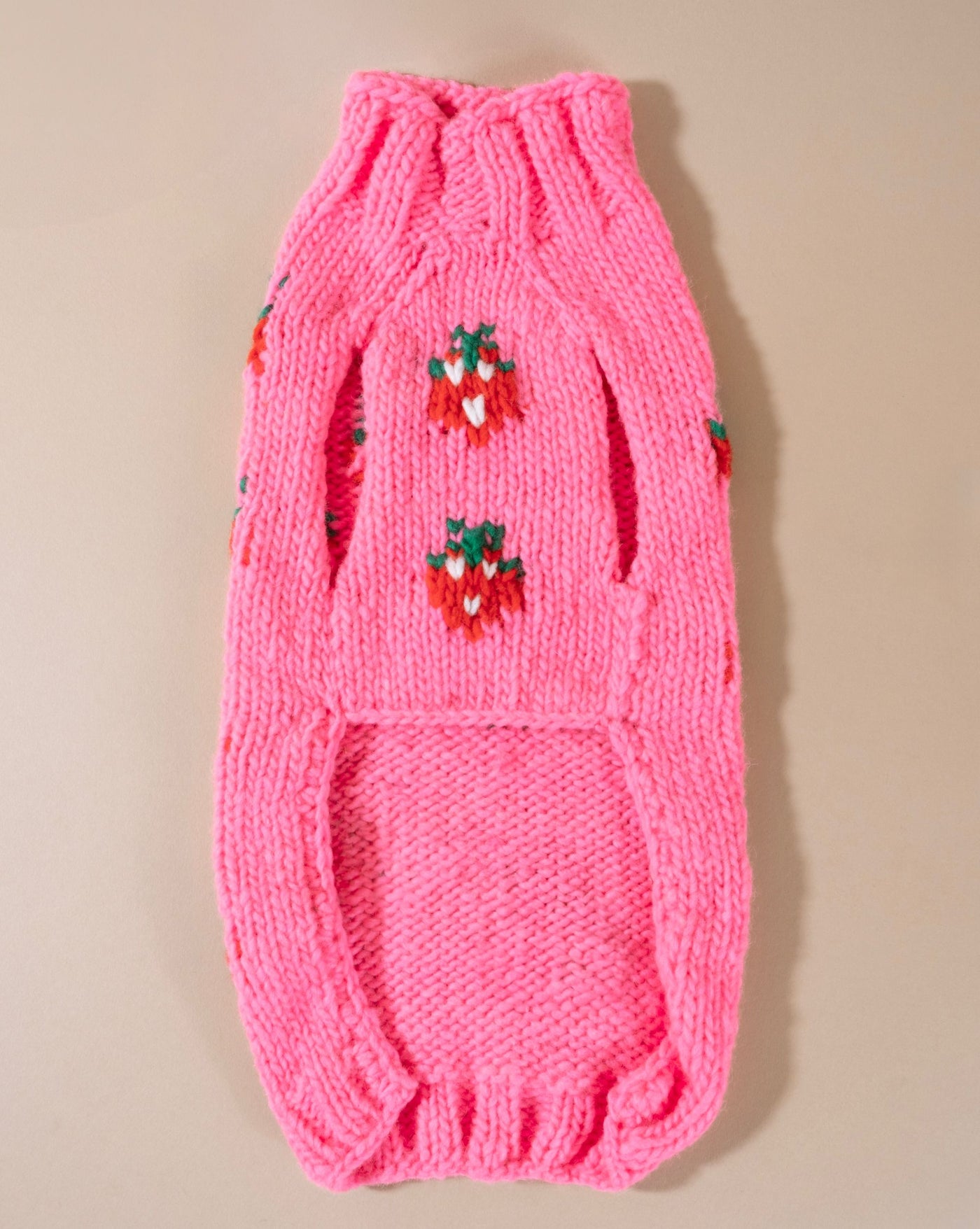 Adorable hot pink dog sweater with playful details, perfect for French Bulldogs or Pugs.