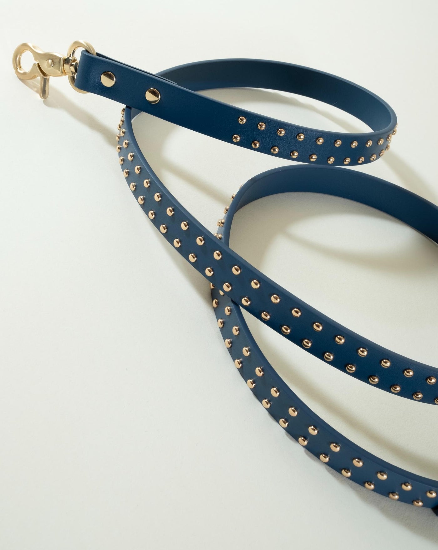 Chic navy blue leather leash with stud accents, perfect for everyday walks with your dog