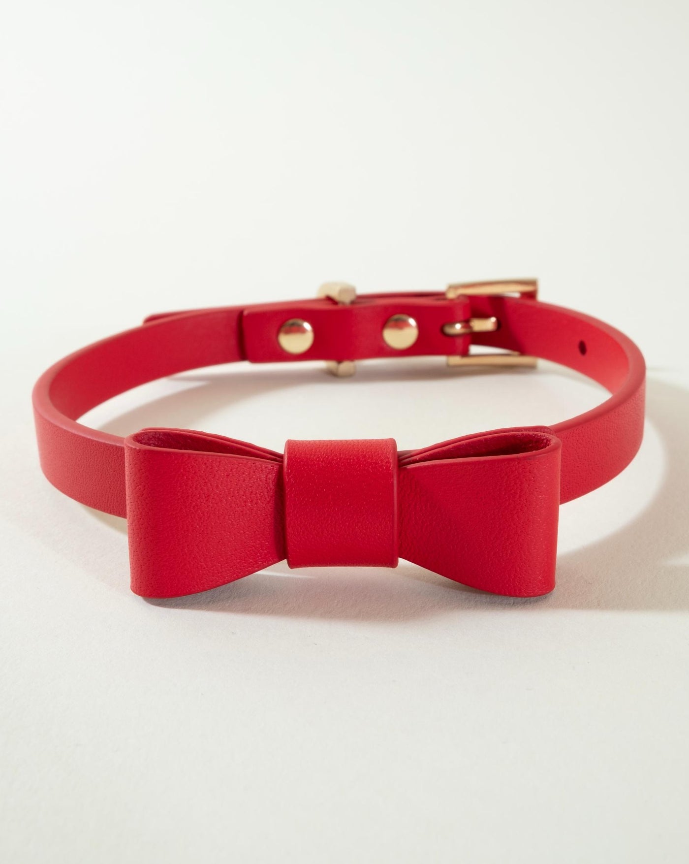 Elegant red bow tie collar for dogs, perfect for formal occasions and special events