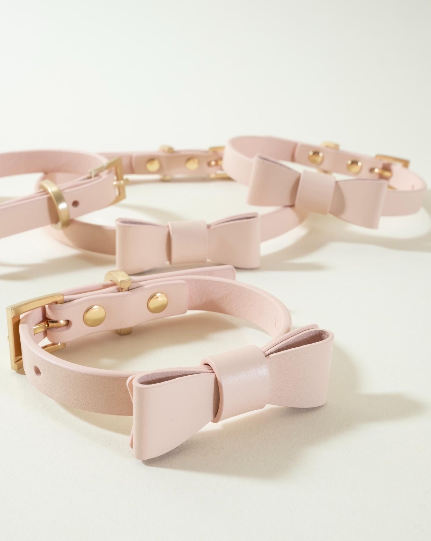 Soft pink bow tie collar for dogs, perfect for adding elegance and style