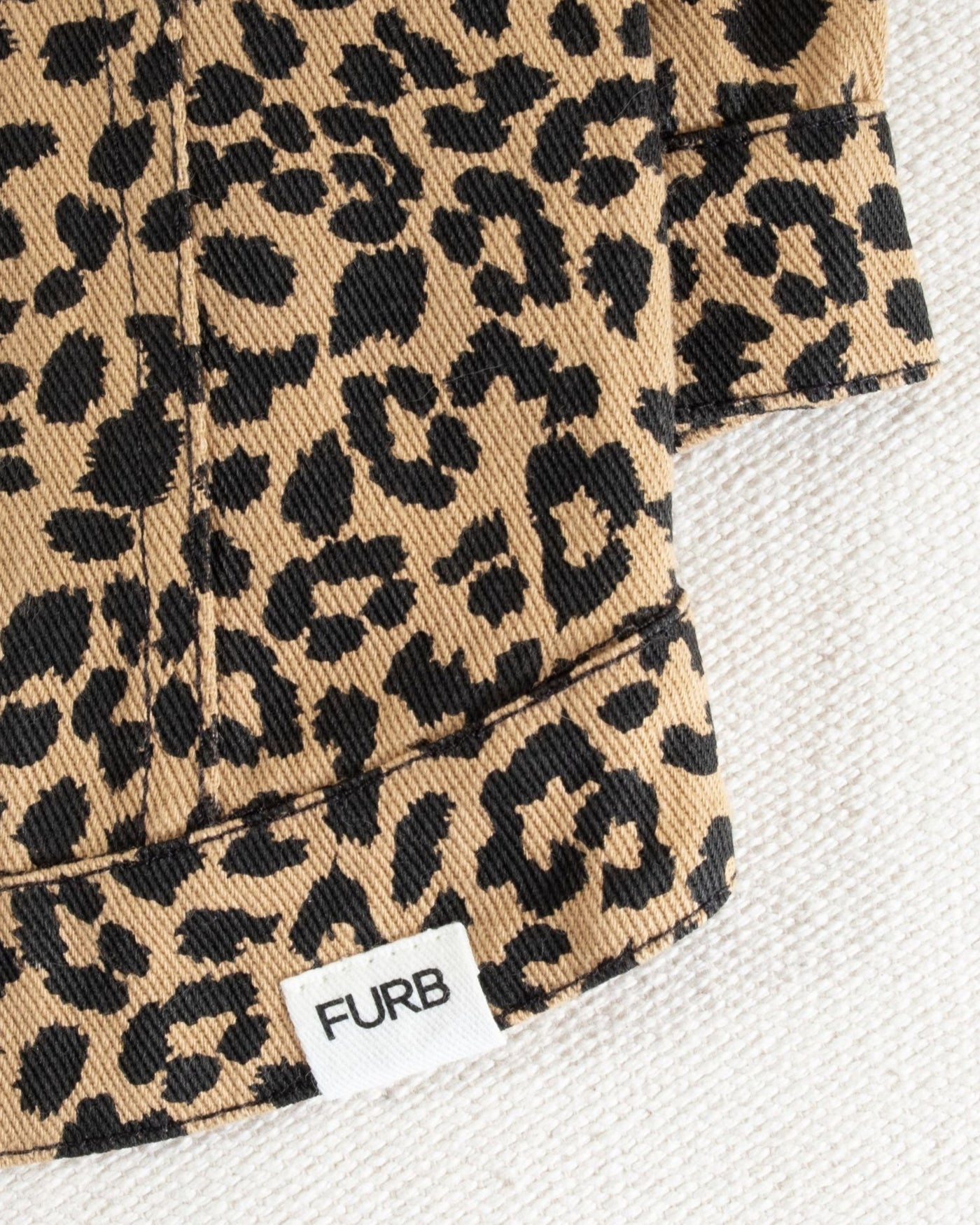 Statement leopard denim dog jacket for small breeds like Shih Tzus and French Bulldogs.