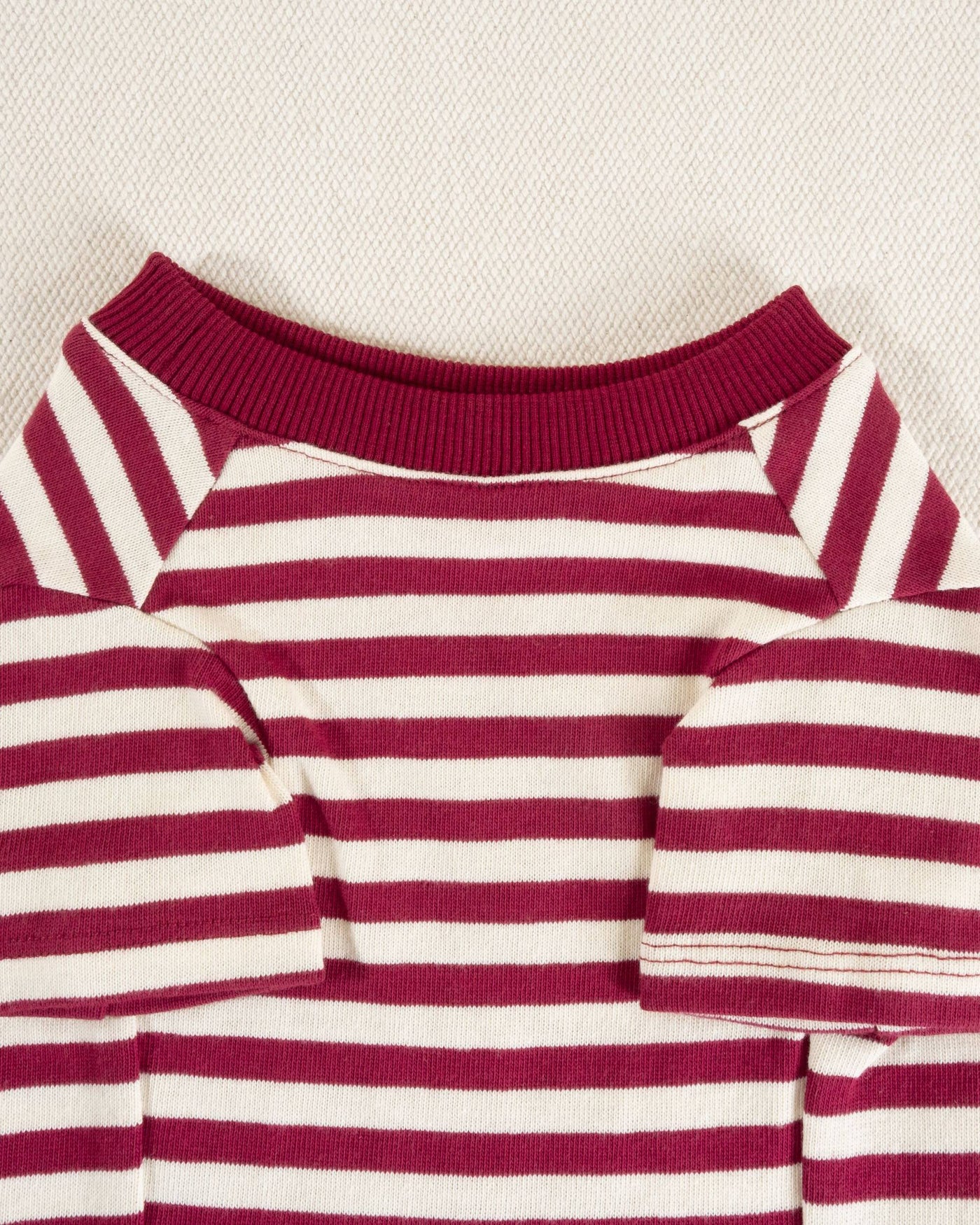 Comfortable red and ivory striped tee, perfect for smaller breeds like Chihuahuas and Dachshunds.