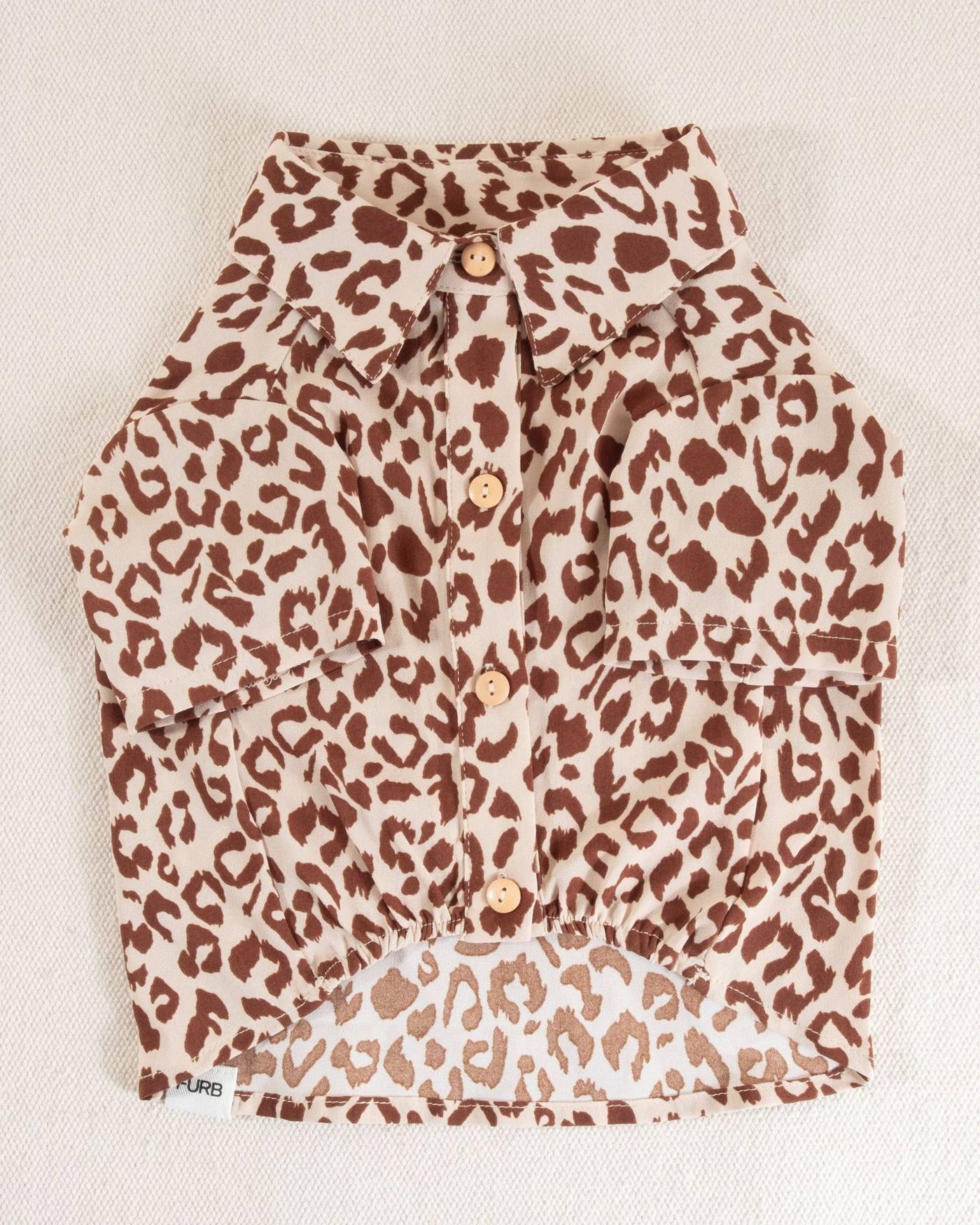 Leopard print dog shirt for small and medium dogs, featuring a button-up design perfect for stylish pets