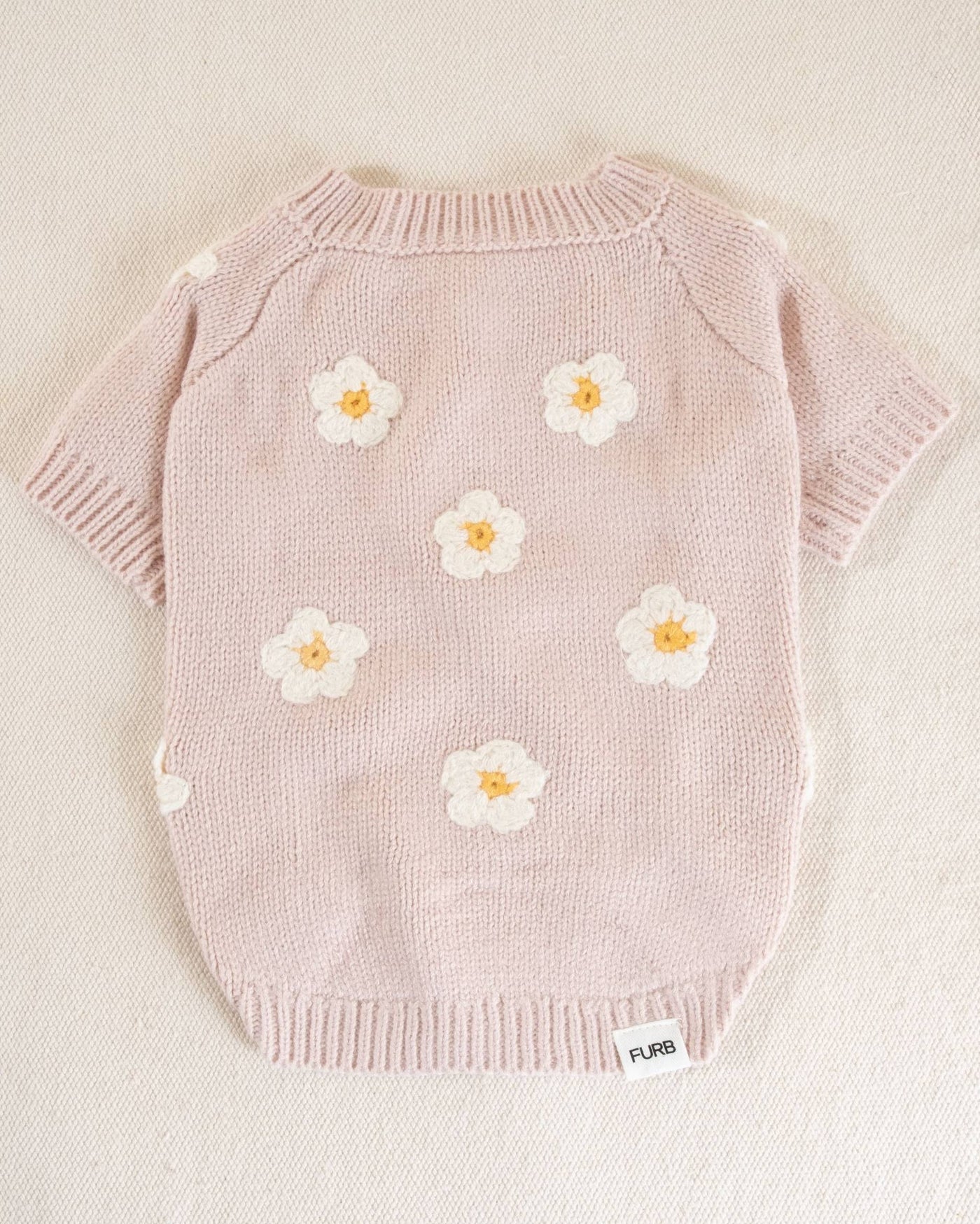 Charming pink sweater with daisy design for small to medium dogs, a perfect addition to your pup's wardrobe.