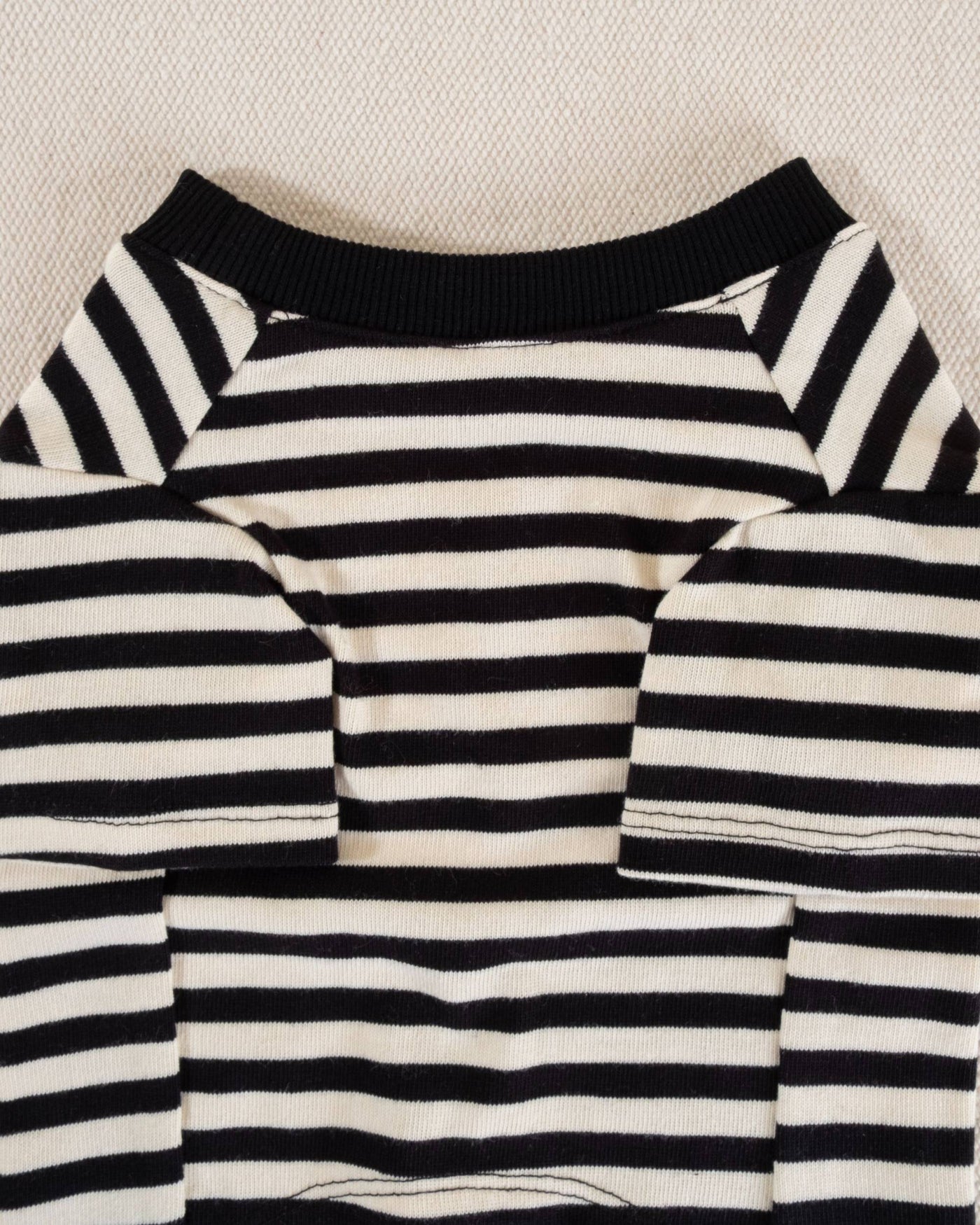 Trendy black and ivory striped dog t-shirt, perfect for breeds like Shih Tzus and French Bulldogs.