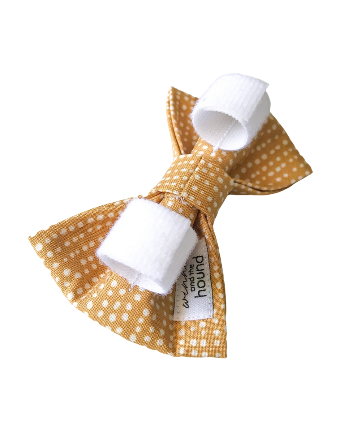 Stylish tan and white dot bow tie, perfect for small and medium-sized dogs to wear during special occasions