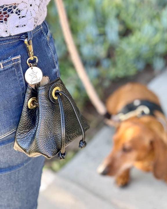 Elegant black leather treat bag with timeless design, perfect for small breeds like Dachshunds or Corgis.