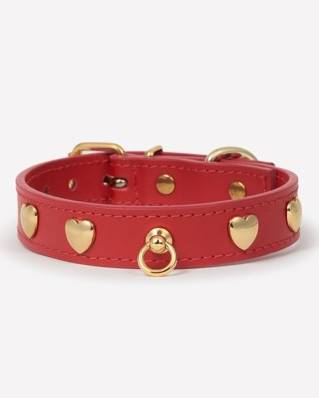 Vibrant red leather dog collar with heart-shaped studs, perfect for adding a pop of color to your dog’s look.