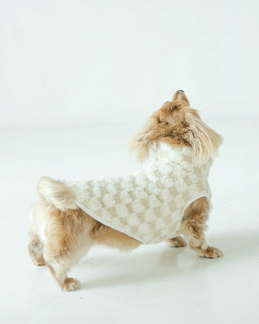 Cozy ivory check vest for dogs, perfect for small breeds like Corgis or Chihuahuas.