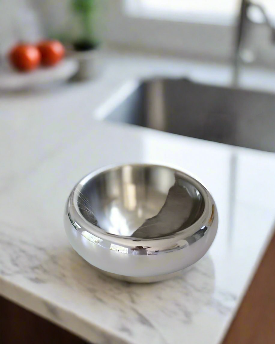 Contemporary chrome pet bowl designed for small dogs, perfect for Corgis or French Bulldogs.